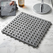Black bathroom anti skidding mat with textured surface and drainage holes