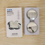 A white box with Chinese text next to two round mirrors in clear plastic packaging.