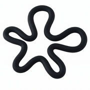 A black silicone flower-shaped hot pot holder on a plain white background, viewed from directly above.