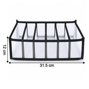 A white mesh and black fabric 6-section drawer organizer with dimensions 31.5 cm length and 12 cm height.