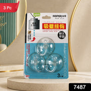 Three transparent suction cup hooks in retail packaging, with a red 