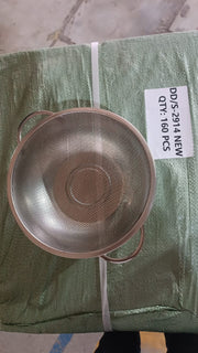 A stainless steel strainer bowl with handles resting on a green woven bag with a label indicating quantity.