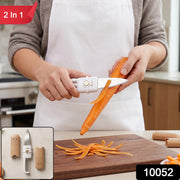 A person uses the white and gold multi-tool to slice a mushroom, with various vegetables blurred in the background.