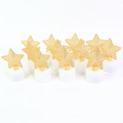 Ten LED tealights with golden mesh stars arranged in two rows on a plain white background.